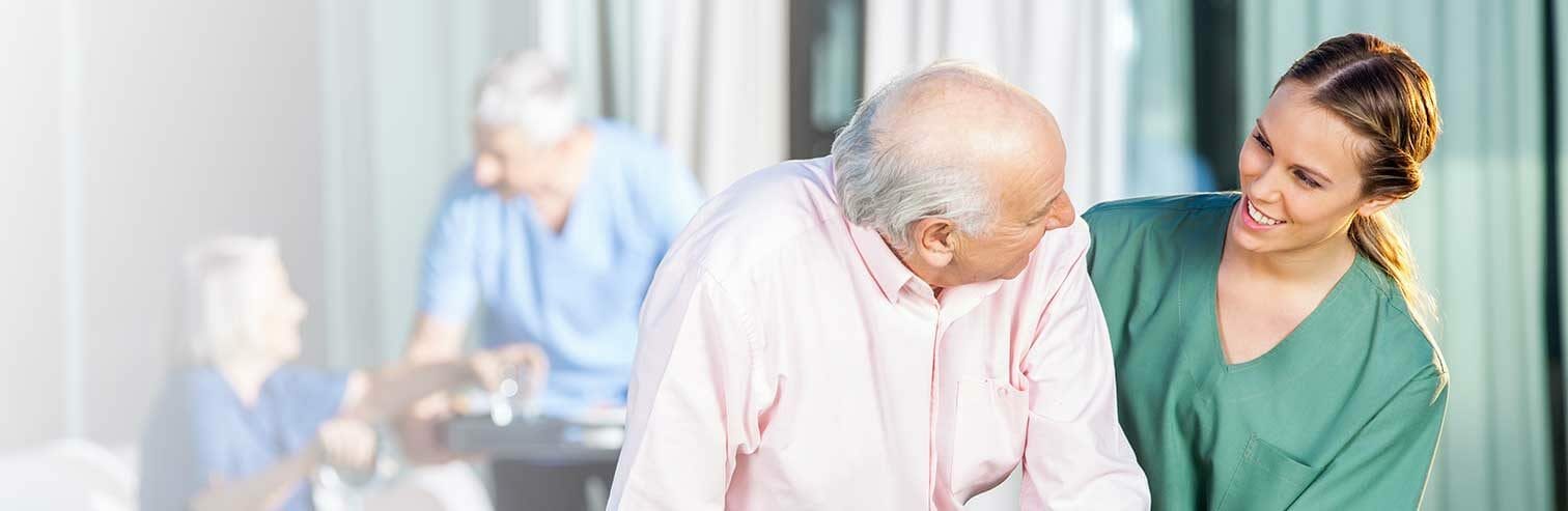 Elderly Man and Nurse Laughing