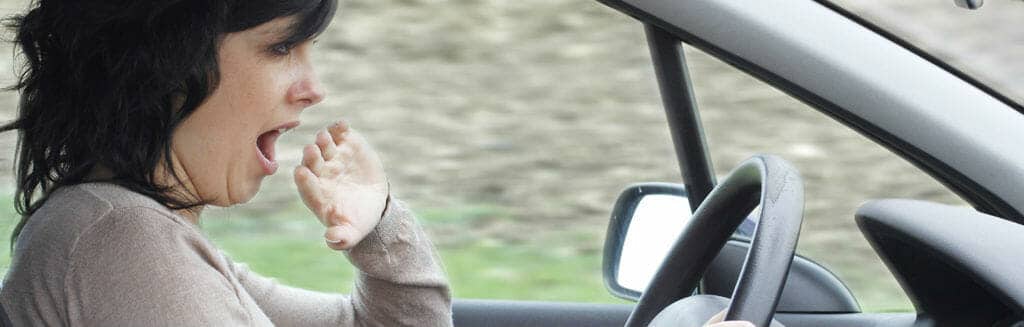 Woman Yawning While Driving